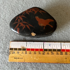 Vintage small triangle black lacquerware trinket box with bamboo leaves and bird in flight