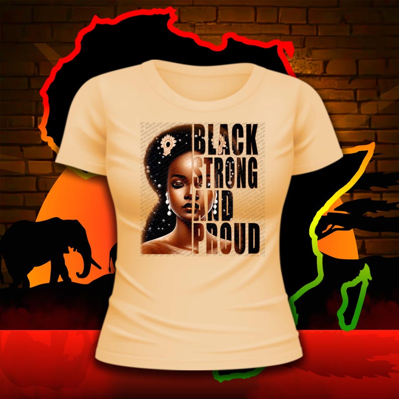 Puede incluir: Una camiseta de color melocot&oacute;n claro con un dise&ntilde;o gr&aacute;fico en blanco y negro. El gr&aacute;fico presenta a una mujer con una corona de flores y el texto "BLACK STRONG AND PROUD".