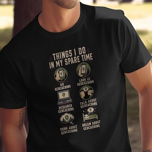 May include: A black short-sleeved t-shirt featuring a graphic with the text "THINGS I DO IN MY SPARE TIME" followed by six icons and labels: "GO GEOCACHING", "LOOK AT GEOCACHING", "RESEARCH GEOCACHING", "TALK ABOUT GEOCACHING", "THINK ABOUT GEOCACHING", and "DREAM ABOUT GEOCACHING".