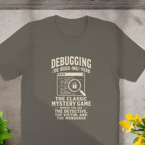 Gray t-shirt with "Debugging: The Classic Mystery Game" text and bug graphic.