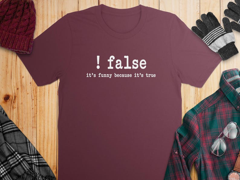 Maroon t-shirt with white text "! false it's funny because it's true".