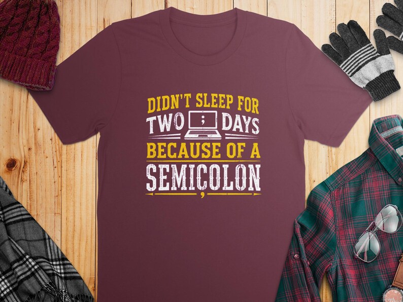 Maroon t-shirt with text "Didn't sleep for two days because of a semicolon".
