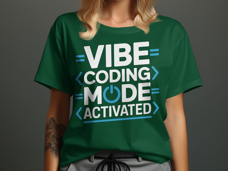 Green t-shirt with "VIBE CODING MODE ACTIVATED" text and a power button symbol.