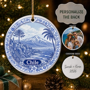 May include: A round white ceramic ornament featuring a blue and white illustration of a coastal Chilean landscape with mountains, a palm tree, and the text Chile. Includes a gold hanging cord and examples of a custom photo and text on the back.