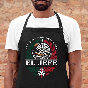 May include: Black apron featuring a white and green Mexican flag design with the text "ESTADOS UNIDOS MEXICANOS" and "EL JEFE".