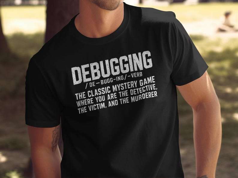 Black t-shirt with white text defining "Debugging" as a classic mystery game.