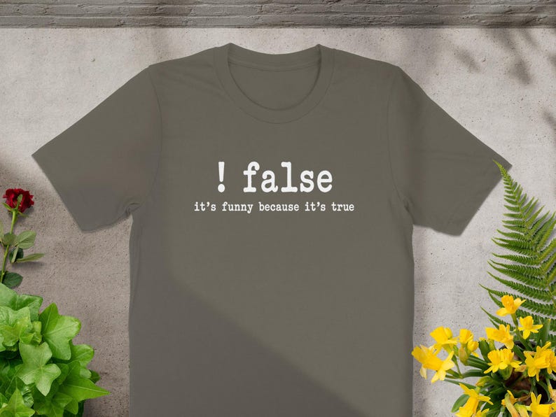Grey t-shirt with text "! false it's funny because it's true".