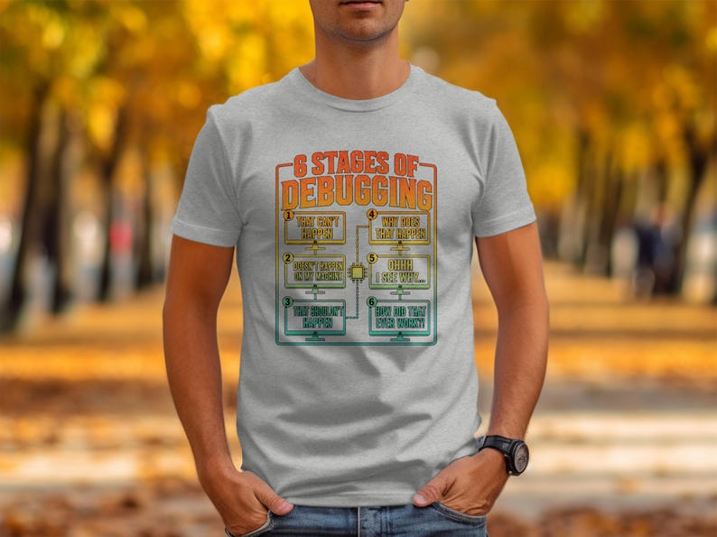 T-shirt with "6 Stages of Debugging" graphic showing 6 humorous steps.
