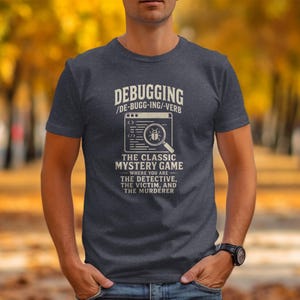 Men's dark t-shirt with "Debugging The Classic Mystery Game" text and bug graphic.
