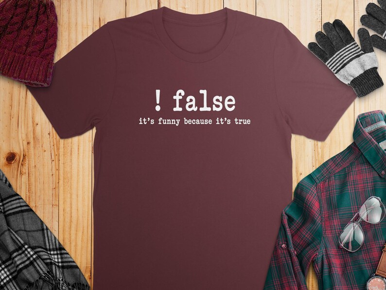 Maroon t-shirt with white text "! false it's funny because it's true".