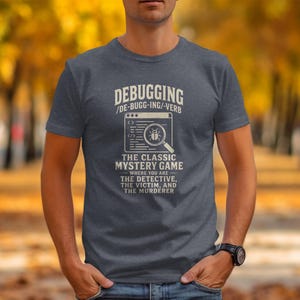 Dark grey t-shirt with text "Debugging: The Classic Mystery Game".
