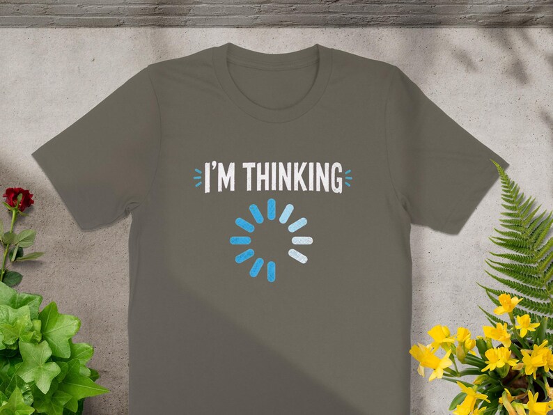 Grey t-shirt with white text "I'M THINKING" and a blue loading circle.