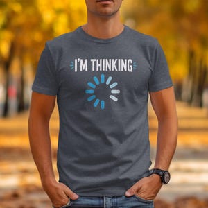 Grey t-shirt with "I'M THINKING" and a blue loading circle graphic.