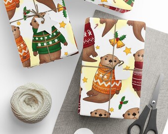 May include: Gift-wrapped presents with a festive otter pattern. The wrapping paper features otters in sweaters, stars, and holiday accents. Twine, scissors, and tags are arranged on a gray surface, suggesting a holiday theme.