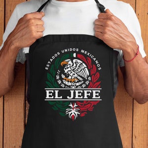 May include: Black apron with a white design featuring the Mexican coat of arms with the text "Estados Unidos Mexicanos" and "El Jefe" below.