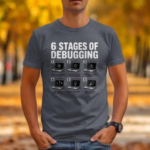 T-shirt with "6 Stages of Debugging" and six laptop graphics depicting programmer frustrations.