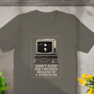 T-shirt graphic with vintage computer and semicolon; text reads: Didn't sleep for two days because of a semicolon.