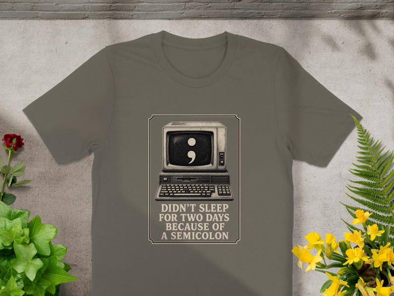 T-shirt graphic with vintage computer and semicolon; text reads: Didn't sleep for two days because of a semicolon.