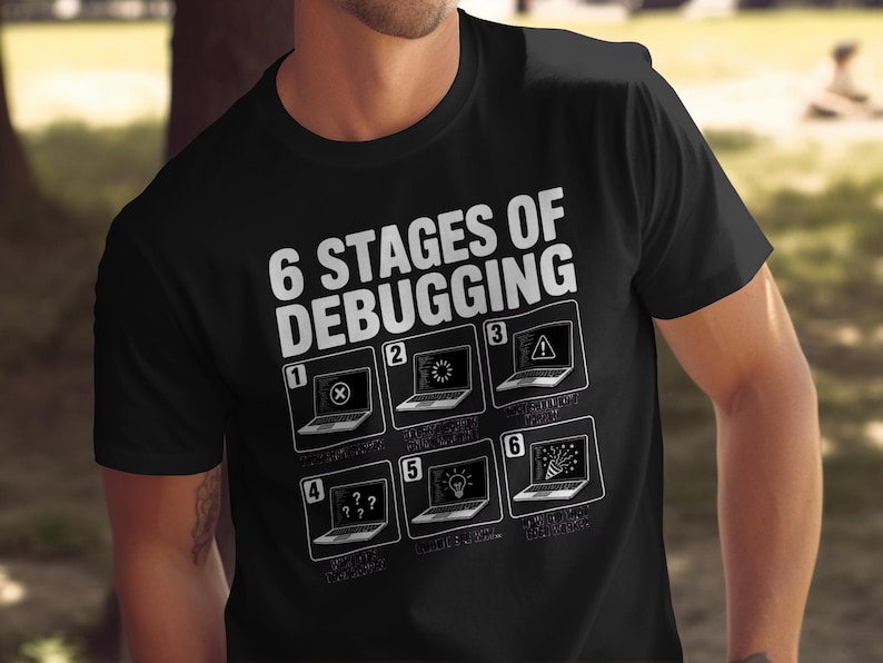 Black t-shirt with "6 Stages of Debugging" and six laptop illustrations depicting coding frustrations.