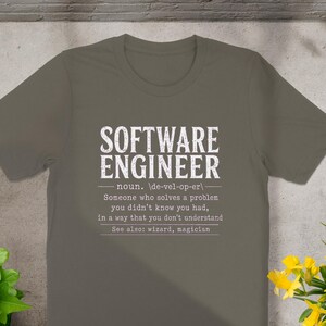 T-shirt with "Software Engineer" definition: "Someone who solves problems you didn't know you had."