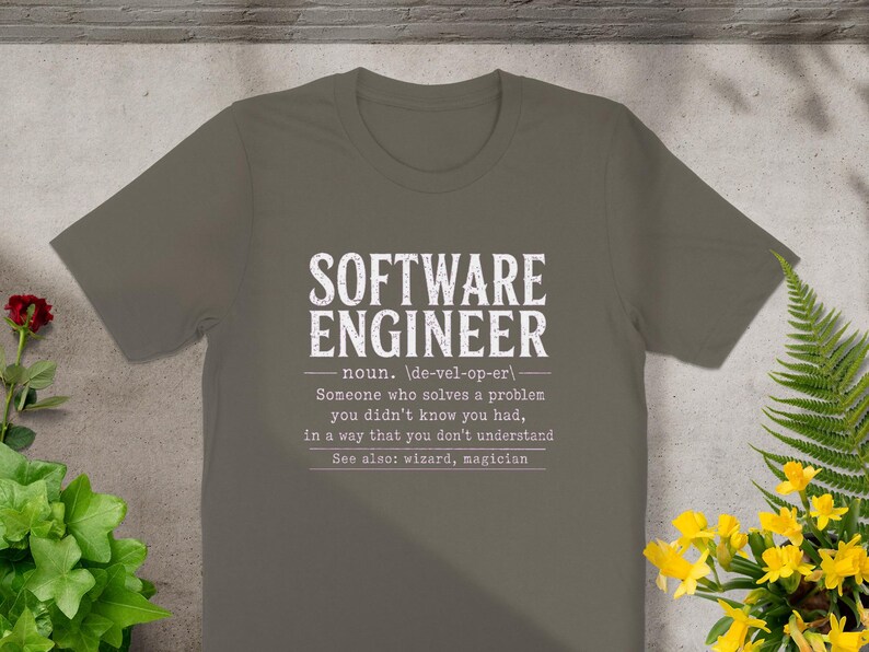 T-shirt with "Software Engineer" definition: "Someone who solves problems you didn't know you had."