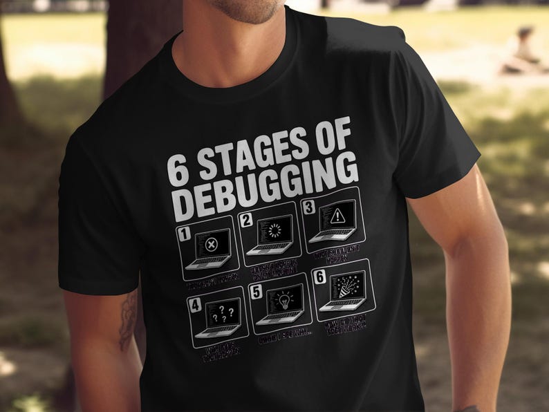 Black t-shirt with "6 Stages of Debugging" and six laptop icons illustrating coding issues.