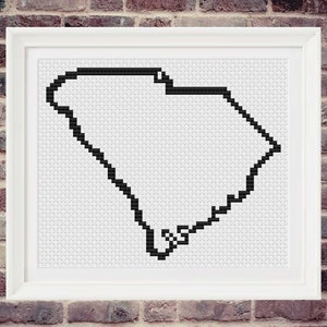 May include: Black and white outline of the state of South Carolina, in a pixelated style, on a white background.