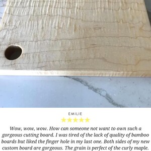 a wooden cutting board with a hole in it