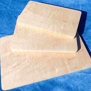 a couple of pieces of wood sitting on top of a blue surface