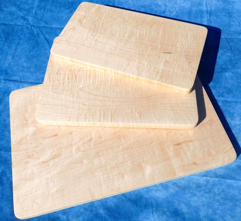 a couple of pieces of wood sitting on top of a blue surface