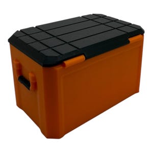 May include: Orange plastic storage box with a black lid. The lid has a textured surface.