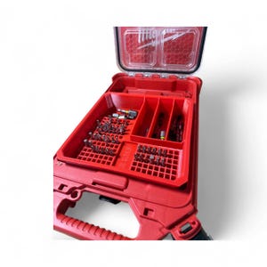 May include: A red tool organizer with a clear lid, filled with various drill bits. The organizer has multiple compartments and a handle for easy carrying. The bits are arranged neatly, showcasing a variety of sizes and types.