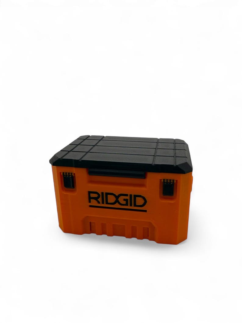 May include: An orange and black tool box with the word "RIDGID" printed on the front.