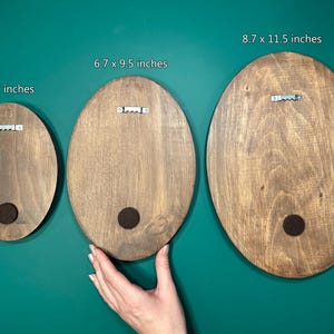 May include: Three round wooden signs with different sizes. The signs are 5 x 7 inches, 6.7 x 9.5 inches, and 8.7 x 11.5 inches. The signs are all brown and have a natural wood finish.