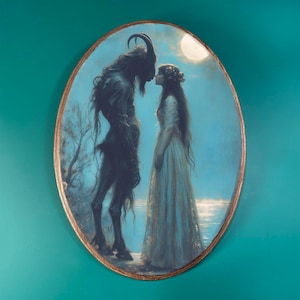 May include: Oval-shaped artwork depicting a dark figure with horns facing a woman in a white dress. The background is a blue sky with a full moon and water. The artwork has a gold-colored border.