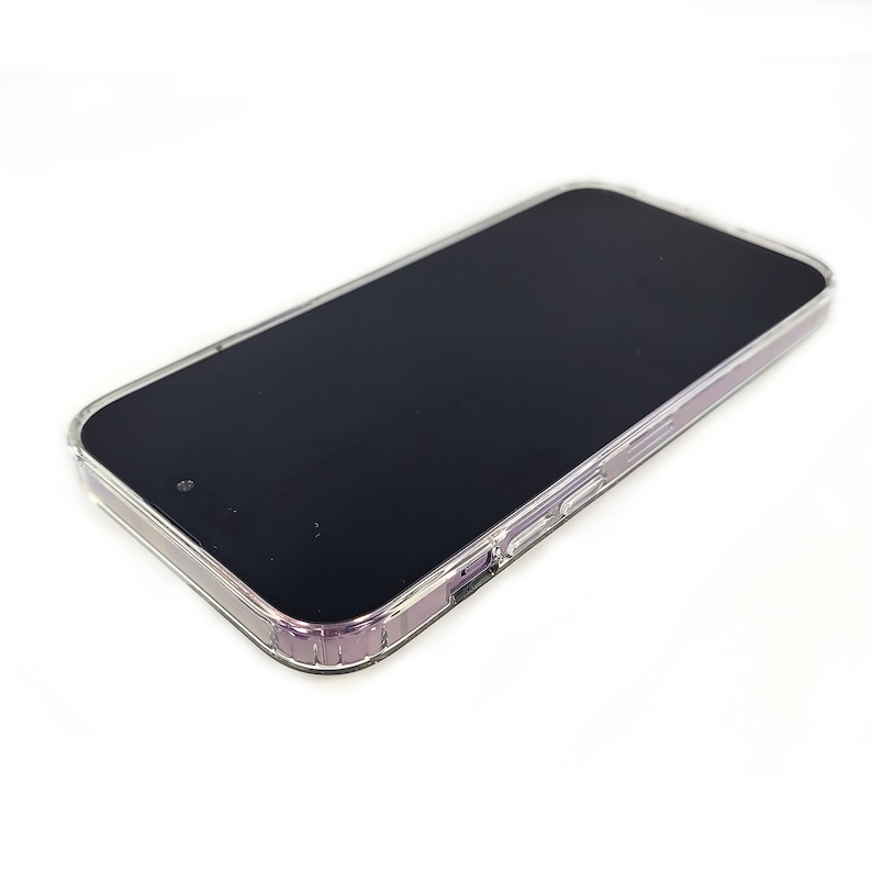 May include: A clear phone case with a black phone inside. The case has a slight purple tint.