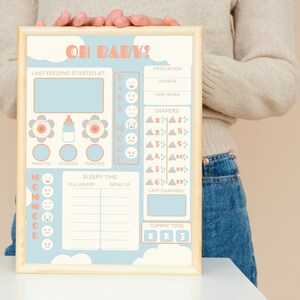 May include: A blue and white baby tracker chart with the words "Oh Baby!" at the top. The chart includes sections for tracking feedings, diaper changes, sleep, and mood. There are also sections for medication and tummy time.
