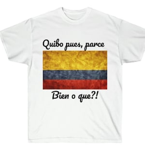May include: White t-shirt with a Colombian flag graphic and the text "Quibo pues, parce Bien o que?!"