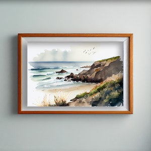 May include: A watercolor painting of a rocky coastline with crashing waves and a sandy beach. The painting is framed in a wooden frame.