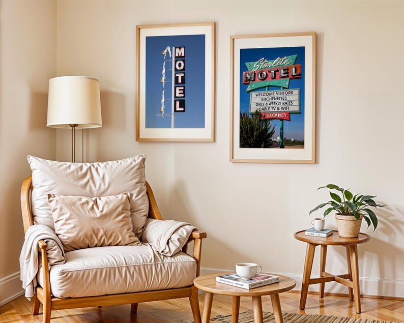 May include: Two framed prints of vintage motel signs hang on a beige wall. One sign reads "MOTEL" vertically against a blue sky. The other, "Starlite MOTEL," features a retro design with "Welcome Visitors" and "Vacancy" text.