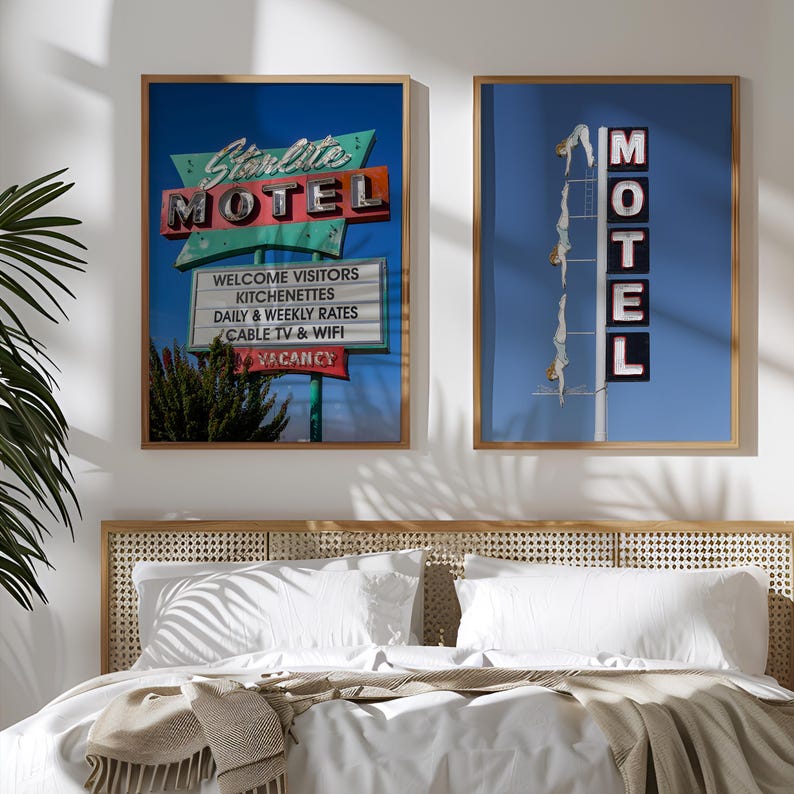 May include: Two framed prints with a retro motel theme. One features a sign that reads "Starlite MOTEL" with "Welcome Visitors" and other text. The other shows a "MOTEL" sign with figures diving. Both have a blue sky background.