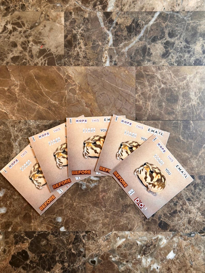 May include: Five brown and white frog stickers with the text "I hope this finds you before I do." on a brown marble surface.