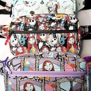 May include: Four colorful fanny packs with zipper closures. The top pack is light blue with Jack and Sally graphics and the text "LOVE YOU TO DEATH". The other packs feature Jack Skellington and Sally designs in various patterns.