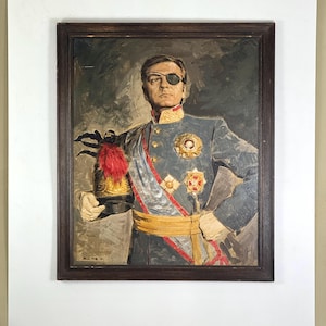 May include: An oil painting in a dark wood frame depicting a figure in a blue military uniform with gold buttons, a yellow sash, and medals. The figure wears a black eye patch and holds a black hat with a red plume. The background is grey.