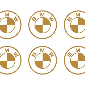 Puede incluir: Seis logotipos BMW de color dorado sobre un fondo blanco. Cada logotipo presenta las letras "B", "M" y "W" dispuestas en un c&iacute;rculo alrededor de un dise&ntilde;o en forma de h&eacute;lice.