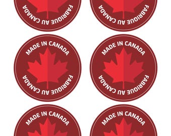 Op de afbeelding: Zes ronde rode stickers met witte tekst die "Made in Canada" en "Fabriqué au Canada" zegt met een rood esdoornblad in het midden.