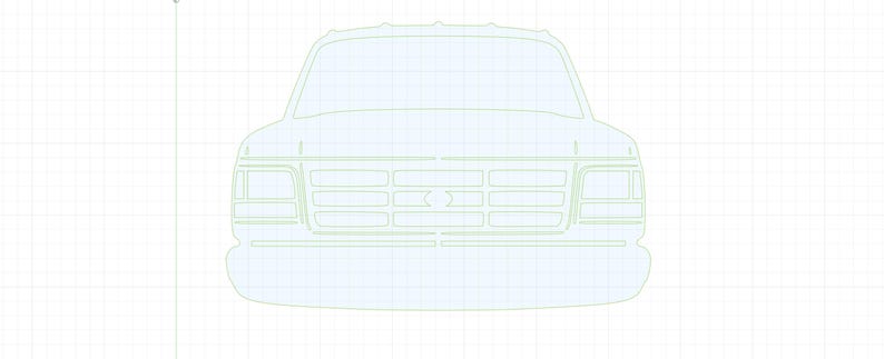 May include: A white front-facing outline of a pickup truck with a black grille and headlights.