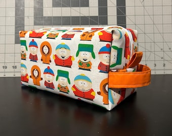South Park Toiletry Bag  White |  8.5 in L X 4 in WX 4.5in H | Duck Fabric Canvas Interior