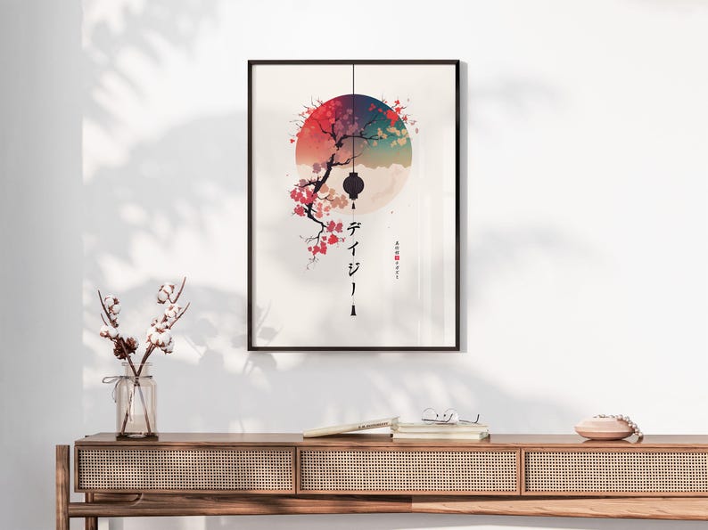May include: Framed art print featuring a Japanese-inspired design. A colorful circle backdrop with a tree branch and cherry blossoms. Japanese characters and a hanging lantern are also visible. The artwork is displayed on a white wall.