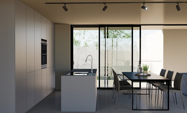 Puede incluir: Una cocina moderna con armarios blancos, un horno de acero inoxidable y una encimera negra. Una mesa de comedor negra con seis sillas est&aacute; en primer plano, y una puerta corredera de vidrio conduce a un patio.